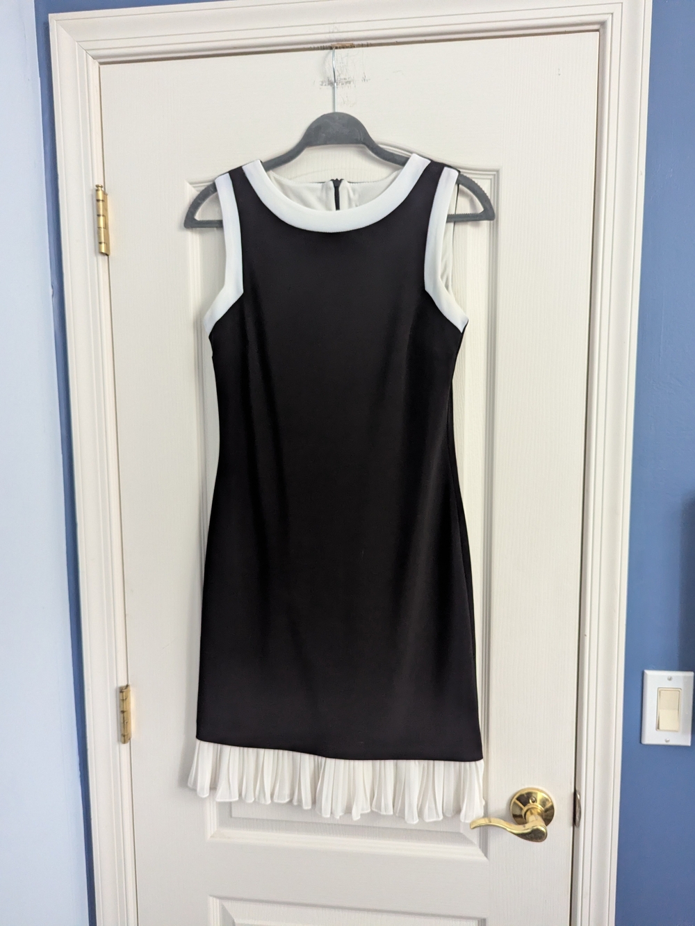 Frank Lyman Design Black Dress with White Trim and Pleated Hem